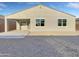 Rear view of house with covered patio and gravel landscaping at 2607 E Corazon Trl, Casa Grande, AZ 85194