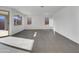 Bright and airy living room with tile floors and sliding glass door access to backyard at 2607 E Corazon Trl, Casa Grande, AZ 85194