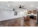 Living room and kitchen with hardwood floors and ceiling fans at 27 N Muleshoe Rd, Apache Junction, AZ 85119