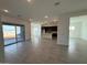 Open kitchen with island, stainless steel appliances, and tile flooring at 31465 N Wet Creek Rd, San Tan Valley, AZ 85143