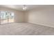Bright bedroom with carpet flooring and sliding glass door at 3600 N 5Th Ave # 304, Phoenix, AZ 85013