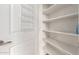 White pantry with shelving and wire spice rack at 3600 N 5Th Ave # 304, Phoenix, AZ 85013