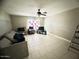 Spacious living room with tile floors and ceiling fan at 3840 N 43Rd Ave # 29, Phoenix, AZ 85031