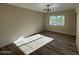 Bright bedroom with wood-look floors and a window at 4057 E Karen Dr, Phoenix, AZ 85032