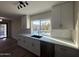 Modern kitchen with white cabinets and quartz counters at 4057 E Karen Dr, Phoenix, AZ 85032