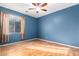 Simple bedroom with light wood floors and blue walls at 4081 E Dublin St, Gilbert, AZ 85295