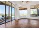 Living room with expansive windows showcasing mountain views at 45425 N 14Th St, New River, AZ 85087