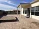 Backyard with patio, playground, and raised garden bed at 6891 W Via Del Sol Dr, Glendale, AZ 85310
