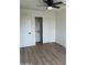 Light bedroom with wood-look floors and large closet at 6891 W Via Del Sol Dr, Glendale, AZ 85310
