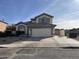 Two-story house with a large garage and well-maintained landscaping at 6891 W Via Del Sol Dr, Glendale, AZ 85310