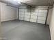 Spacious garage with light grey epoxy floor at 6891 W Via Del Sol Dr, Glendale, AZ 85310