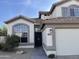 Front view of two-story house with a decorative door and walkway at 6891 W Via Del Sol Dr, Glendale, AZ 85310