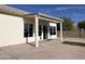 Large covered patio with tiled flooring, and sliding glass door at 6891 W Via Del Sol Dr, Glendale, AZ 85310
