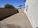 Side yard with gravel surface and gated access at 6891 W Via Del Sol Dr, Glendale, AZ 85310