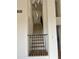 Modern staircase with metal railing and unique lighting fixture at 6891 W Via Del Sol Dr, Glendale, AZ 85310