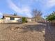 Large backyard with gravel landscaping and a storage shed at 724 N 66Th Pl, Mesa, AZ 85205