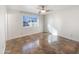 Simple bedroom with tile flooring and a large window at 724 N 66Th Pl, Mesa, AZ 85205