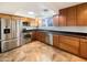 Modern kitchen with stainless steel appliances and granite countertops at 724 N 66Th Pl, Mesa, AZ 85205