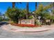 The Pavilions community entrance with landscaping and signage at 7272 E Gainey Ranch Rd # 73, Scottsdale, AZ 85258