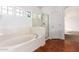 Bathroom with a soaking tub, shower, and tile floors at 10350 W Foothill Dr, Peoria, AZ 85383