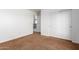 Spacious bedroom with brown carpet and double door closet at 10350 W Foothill Dr, Peoria, AZ 85383