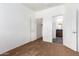 Bedroom with carpet, private bathroom access, and walk-in closet at 10350 W Foothill Dr, Peoria, AZ 85383