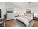 Main bedroom with king-size bed and cityscape decor at 10350 W Foothill Dr, Peoria, AZ 85383