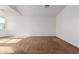 Bright bedroom featuring neutral decor and brown carpet at 10350 W Foothill Dr, Peoria, AZ 85383