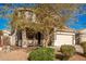 Two story home with attached garage and mature landscaping at 10350 W Foothill Dr, Peoria, AZ 85383