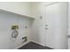 Laundry room with built-in shelving and door at 10350 W Foothill Dr, Peoria, AZ 85383