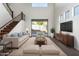 Bright living room with hardwood floors, furniture, and high ceilings at 10350 W Foothill Dr, Peoria, AZ 85383
