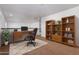 Home office with built-in shelving and a large desk at 10350 W Foothill Dr, Peoria, AZ 85383