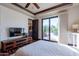 Guest bedroom with private access to the backyard pool area at 10742 E Greythorn Dr, Scottsdale, AZ 85262
