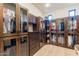 Large walk-in closet with ample shelving and hanging space at 10742 E Greythorn Dr, Scottsdale, AZ 85262