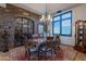 Formal dining room features a large table, chandelier, and wine room access at 10742 E Greythorn Dr, Scottsdale, AZ 85262