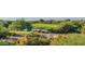 Landscaped golf course with a pond and lush greenery at 10742 E Greythorn Dr, Scottsdale, AZ 85262