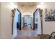 Elegant hallway with arched brick ceiling and ornate wall sconces at 10742 E Greythorn Dr, Scottsdale, AZ 85262