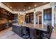 Gourmet kitchen with large island, dark wood cabinets, and granite countertops at 10742 E Greythorn Dr, Scottsdale, AZ 85262
