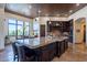 Gourmet kitchen with large island, granite countertops, and custom cabinetry at 10742 E Greythorn Dr, Scottsdale, AZ 85262