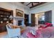 Cozy library featuring a fireplace, built-in shelves, and comfortable seating at 10742 E Greythorn Dr, Scottsdale, AZ 85262