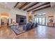 Spacious living room with high ceilings, hardwood floors, and a fireplace at 10742 E Greythorn Dr, Scottsdale, AZ 85262