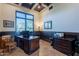 Home office with built-in cabinetry, large window, and hardwood floors at 10742 E Greythorn Dr, Scottsdale, AZ 85262