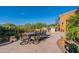 Outdoor kitchen and dining area with built-in grill at 10742 E Greythorn Dr, Scottsdale, AZ 85262