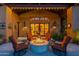 Cozy patio with fire pit and comfortable seating at 10742 E Greythorn Dr, Scottsdale, AZ 85262