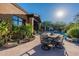 Outdoor patio furniture with seating for dining al fresco at 10742 E Greythorn Dr, Scottsdale, AZ 85262