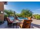Relaxing poolside patio with fire pit and comfortable seating at 10742 E Greythorn Dr, Scottsdale, AZ 85262