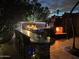 Outdoor kitchen, fireplace, and seating area create a relaxing backyard oasis at 10801 N 45Th St, Phoenix, AZ 85028