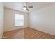 Well-lit bedroom with hardwood floors and ceiling fan at 10801 N 45Th St, Phoenix, AZ 85028