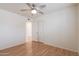 Bright bedroom with wood flooring, ceiling fan, and ample closet space at 10801 N 45Th St, Phoenix, AZ 85028