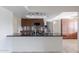 Kitchen with dark wood cabinets and granite countertops at 10801 N 45Th St, Phoenix, AZ 85028